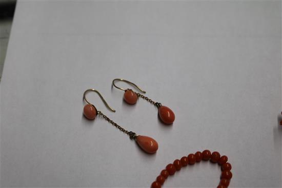 A group of assorted coral jewellery, including necklaces.